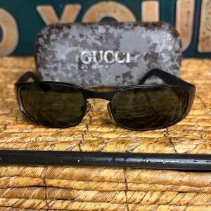 Gucci Dark Sunglasses with Textured Case